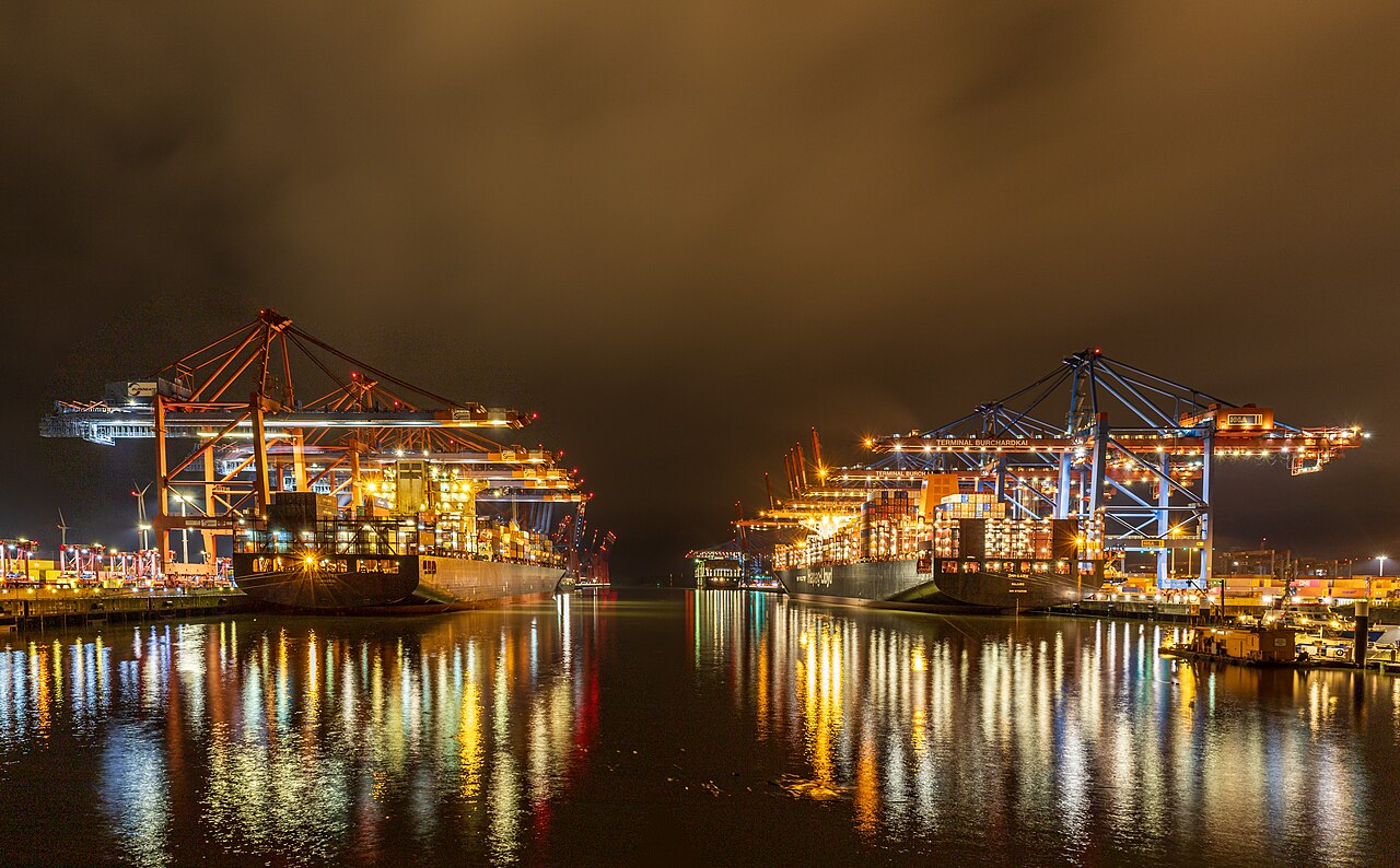 Port of Hamburg container terminal at night, showcasing global shipping